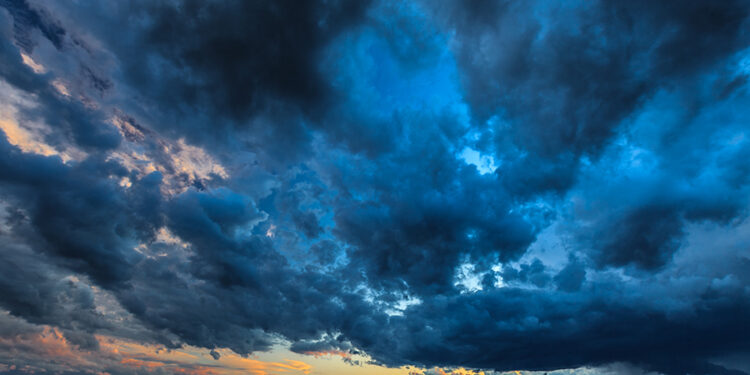 Dark storm clouds on evening sky. Danube River, Romania