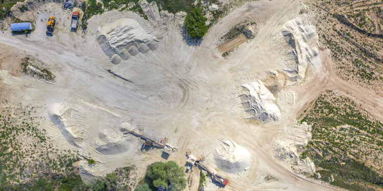 Top view on a quarry. Aerial view from drone on a mining of natural resources or ore